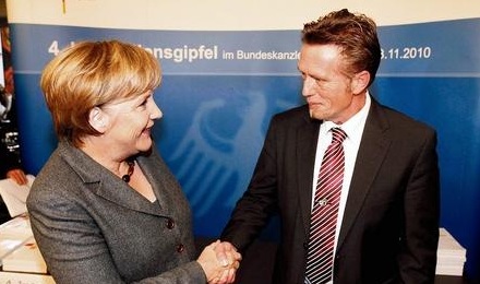 Christian Horn (r.) mit Angela Merkel